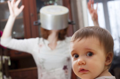 Scared baby against crazy mother