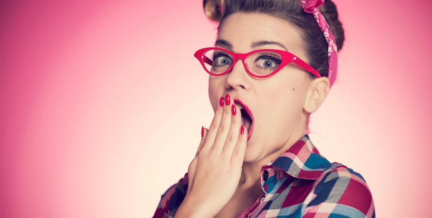 Portrait of shocked pin-up girl